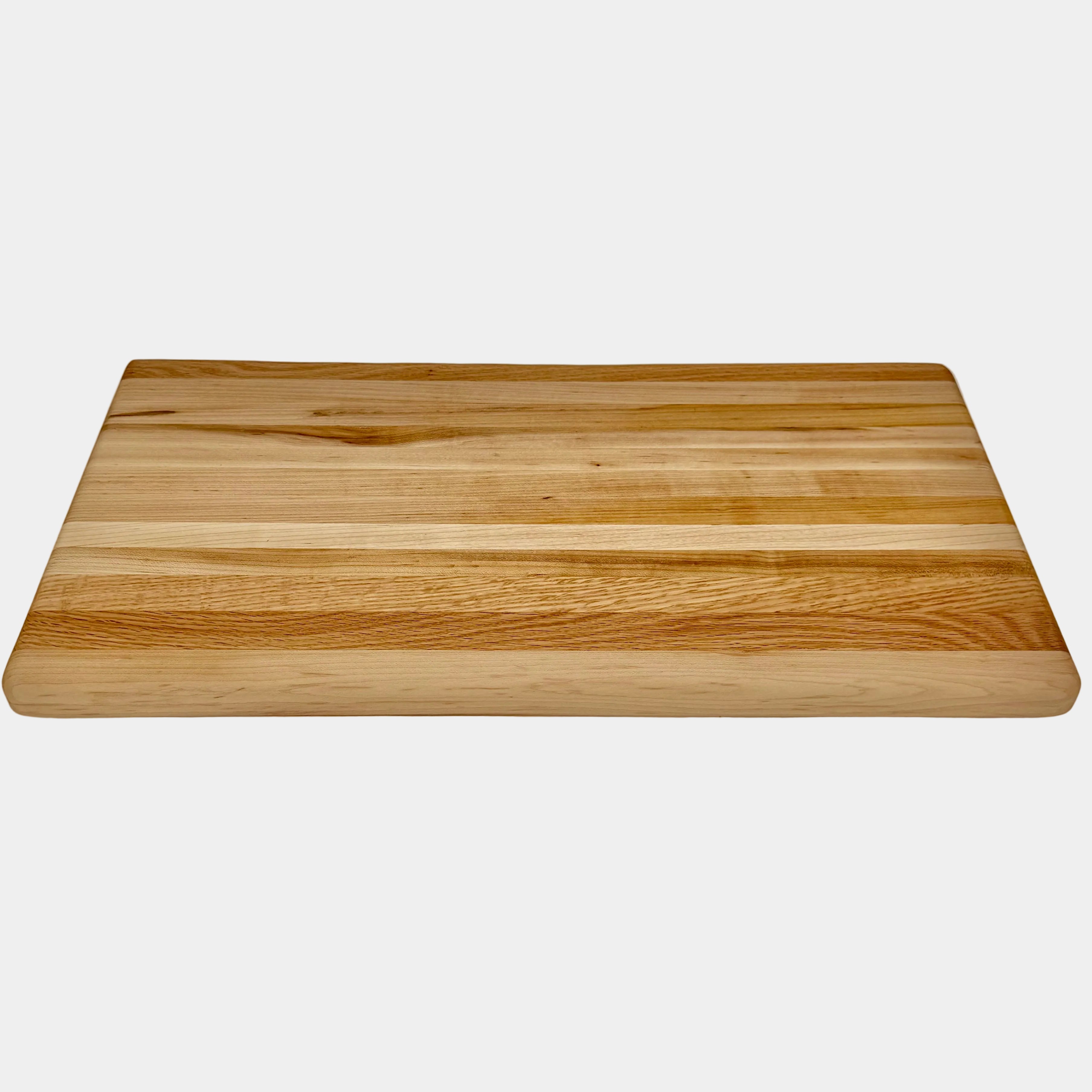 Maple wood cutting board on a white background